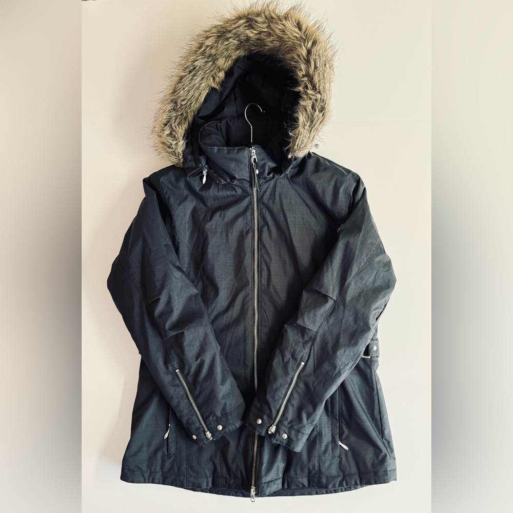 Size 16 Obermeyer Ski Parka- black with stud details 4 pockets.Removable hood.